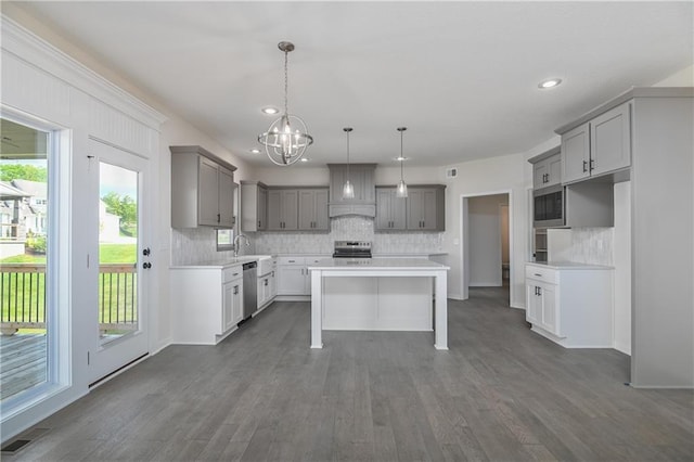 111 N Singletree St, Olathe, KS 66061 - kitchen with appliances with stainless steel finishes, gray cabinetry, decorative backsplash, and recessed lighting