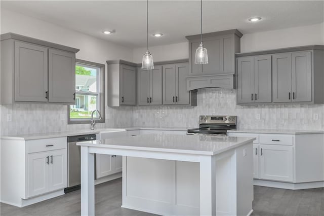 111 N Singletree St, Olathe, KS 66061 - kitchen featuring stainless steel appliances, gray cabinetry, custom exhaust hood, wood finished floors, and recessed lighting