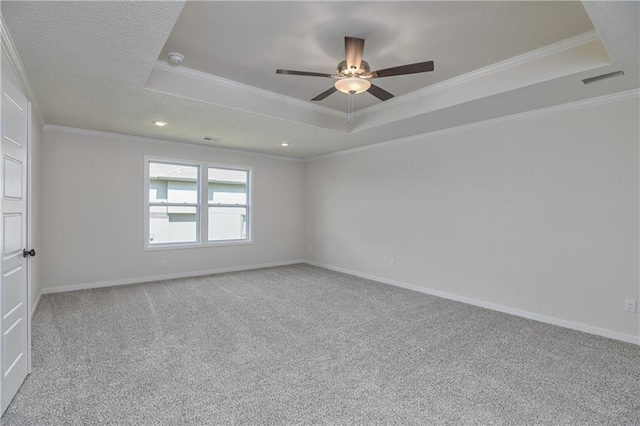 111 N Singletree St, Olathe, KS 66061 - carpeted spare room with a tray ceiling, a ceiling fan, crown molding, baseboards, and recessed lighting