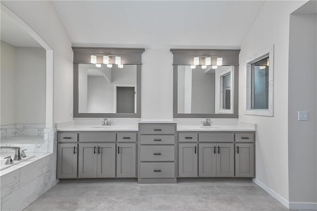 111 N Singletree St, Olathe, KS 66061 - bathroom featuring double vanity, a garden tub, and baseboards