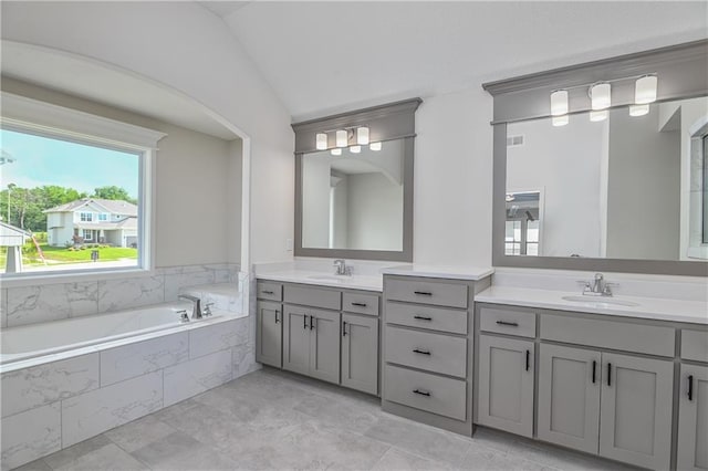 111 N Singletree St, Olathe, KS 66061 - full bathroom with double vanity, a garden tub, and vaulted ceiling