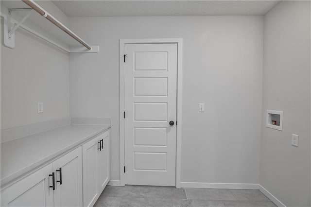 111 N Singletree St, Olathe, KS 66061 - laundry room featuring washer hookup, baseboards, and cabinet space