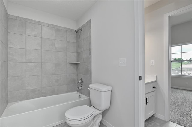 111 N Singletree St, Olathe, KS 66061 - bathroom with toilet, vanity, washtub / shower combination, and baseboards
