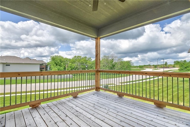 111 N Singletree St, Olathe, KS 66061 - wooden deck with a lawn and ceiling fan
