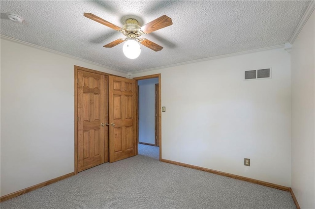 313 SW Ensley Ln, Lees Summit, MO 64081 - unfurnished bedroom with ornamental molding, light carpet, baseboards, a textured ceiling, and ceiling fan