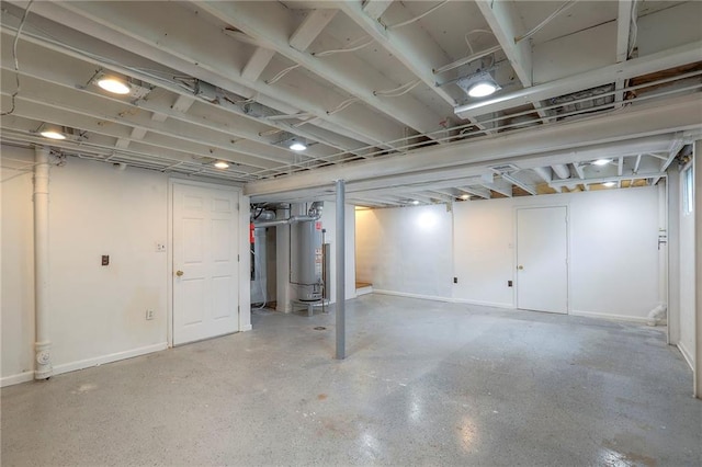 313 SW Ensley Ln, Lees Summit, MO 64081 - unfinished basement featuring water heater and baseboards