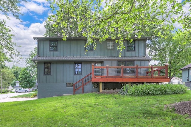 313 SW Ensley Ln, Lees Summit, MO 64081 - rear view of house featuring a lawn, a wooden deck, board and batten siding, and stairway