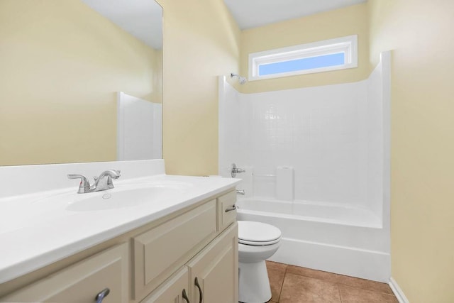 bathroom featuring toilet, vanity, washtub / shower combination, and tile patterned floors