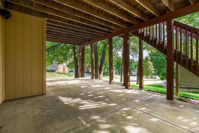 view of patio with stairway and a shed