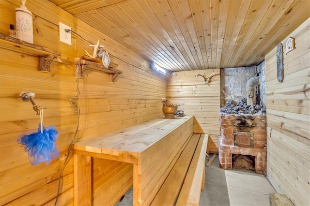relaxing sauna / steam room with wood walls and wood ceiling