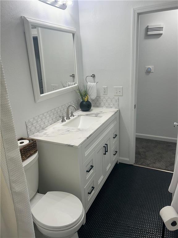 1919 Seneca St, Leavenworth, KS 66048 - bathroom featuring toilet and vanity