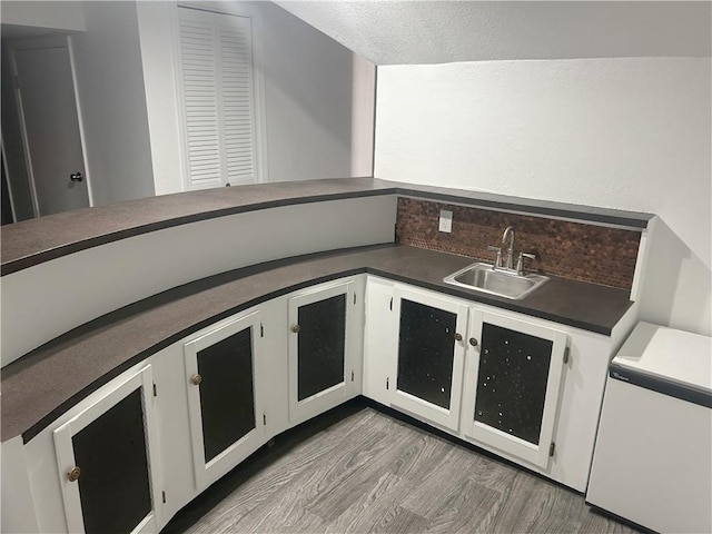 1919 Seneca St, Leavenworth, KS 66048 - bar with a sink, wood finished floors, and fridge