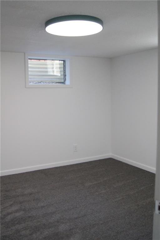 1919 Seneca St, Leavenworth, KS 66048 - basement with dark colored carpet and baseboards