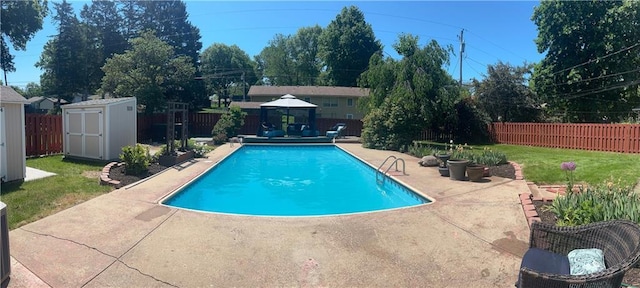 1919 Seneca St, Leavenworth, KS 66048 - view of pool with a gazebo, a storage unit, a patio, an outbuilding, and an outdoor hangout area