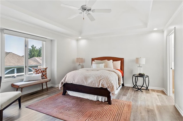5037 W 120th Ter, Overland Park, KS 66209 - bedroom featuring light wood-type flooring, recessed lighting, ornamental molding, a ceiling fan, and a raised ceiling