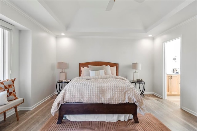 5037 W 120th Ter, Overland Park, KS 66209 - bedroom featuring light wood finished floors, recessed lighting, ensuite bathroom, a tray ceiling, and ceiling fan