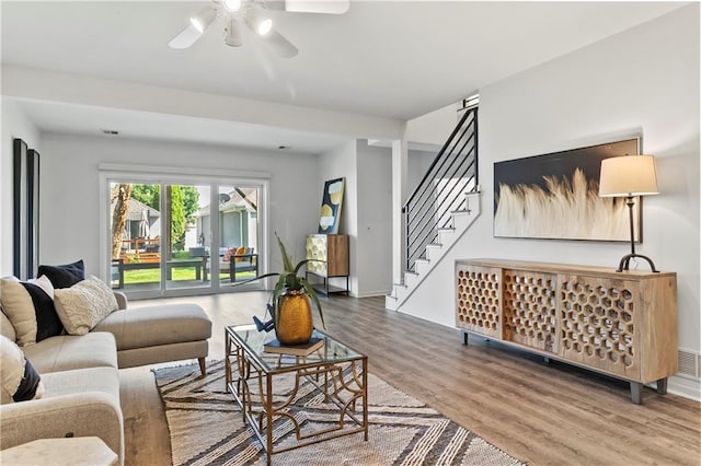 5037 W 120th Ter, Overland Park, KS 66209 - living area with a ceiling fan, wood finished floors, and stairs