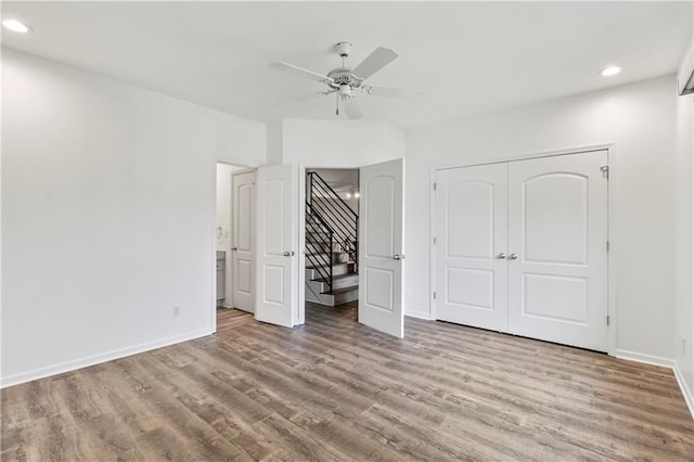 5037 W 120th Ter, Overland Park, KS 66209 - unfurnished bedroom with wood finished floors, recessed lighting, a closet, and ceiling fan