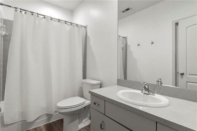 5037 W 120th Ter, Overland Park, KS 66209 - bathroom with vanity, wood finished floors, and shower / bath combo