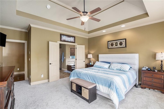 25205 W 97th Ter, Lenexa, KS 66227 - carpeted bedroom with a tray ceiling, ornamental molding, ensuite bathroom, a ceiling fan, and recessed lighting