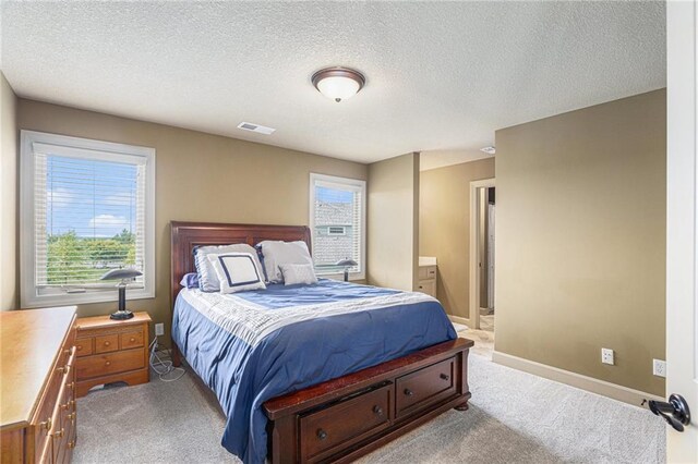25205 W 97th Ter, Lenexa, KS 66227 - bedroom featuring light carpet, multiple windows, and a textured ceiling
