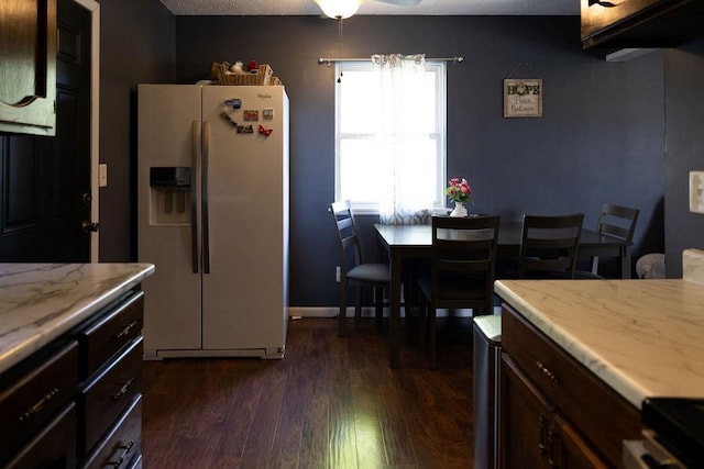 108 N Evanston Ave, Independence, MO 64053 - kitchen with white fridge with ice dispenser, dark wood-style flooring, stove, ceiling fan, and dark brown cabinetry