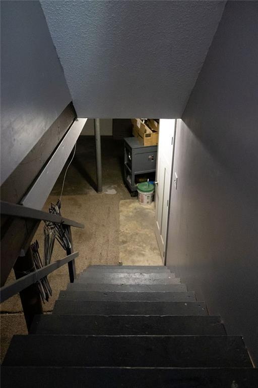 108 N Evanston Ave, Independence, MO 64053 - stairway featuring a textured ceiling