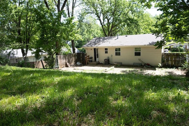 108 N Evanston Ave, Independence, MO 64053 - rear view of house with central AC unit and a patio area