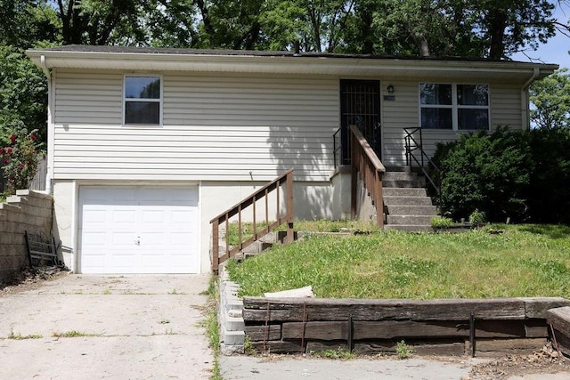 108 N Evanston Ave, Independence, MO 64053 - view of front facade with a garage and concrete driveway
