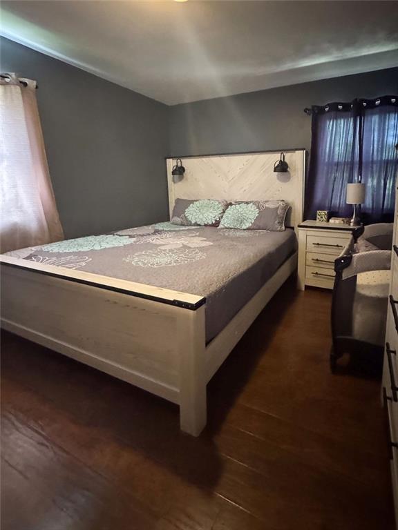 108 N Evanston Ave, Independence, MO 64053 - bedroom with dark wood-style floors