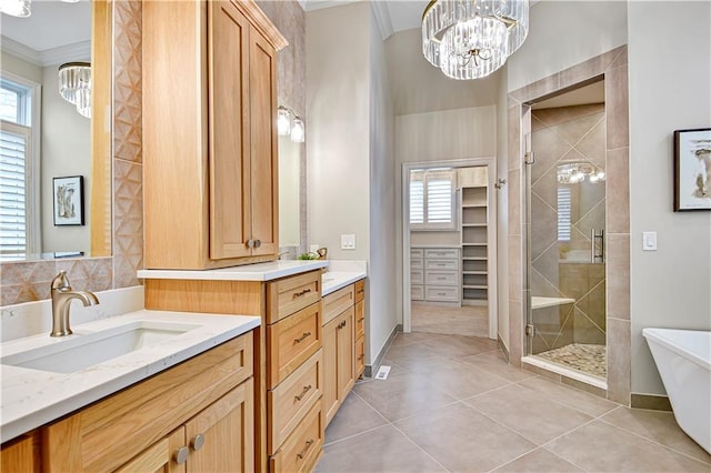 11349 Buena Vista St, Leawood, KS 66211 - full bath with a stall shower, ornamental molding, a chandelier, tile patterned floors, and vanity