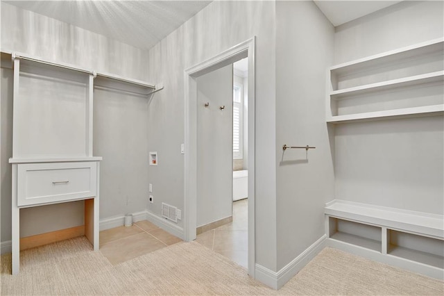 11349 Buena Vista St, Leawood, KS 66211 - mudroom with baseboards and light tile patterned floors