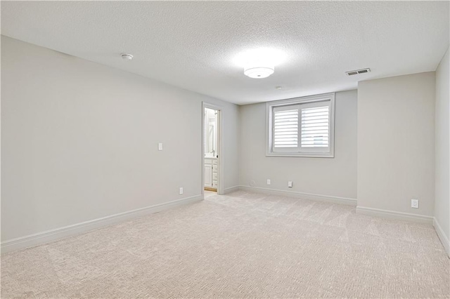 11349 Buena Vista St, Leawood, KS 66211 - empty room with a textured ceiling, baseboards, light carpet, and a smoke detector