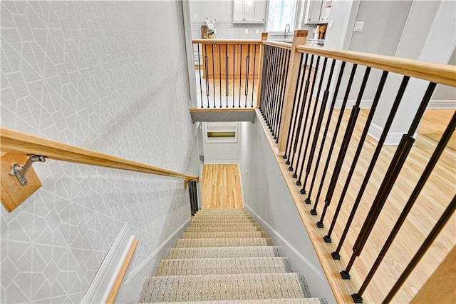11349 Buena Vista St, Leawood, KS 66211 - stairs featuring wood finished floors and baseboards