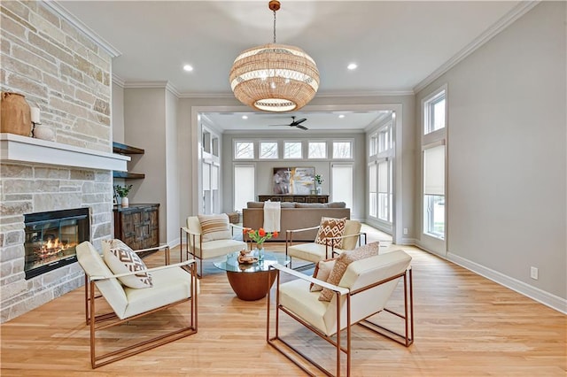 11349 Buena Vista St, Leawood, KS 66211 - living room featuring healthy amount of natural light, ornamental molding, wood finished floors, ceiling fan, and baseboards
