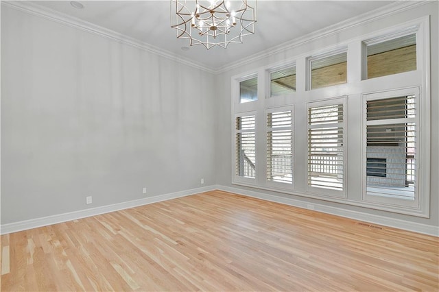 11349 Buena Vista St, Leawood, KS 66211 - unfurnished room featuring light wood-style flooring, a chandelier, baseboards, and crown molding