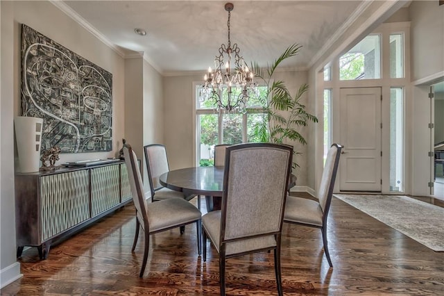 14814 Sherwood St, Leawood, KS 66224 - dining area with a chandelier, healthy amount of natural light, wood finished floors, baseboards, and ornamental molding