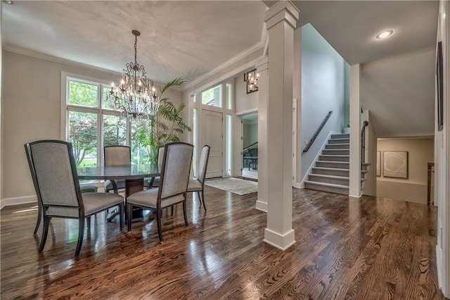 14814 Sherwood St, Leawood, KS 66224 - dining area with a chandelier, stairway, ornamental molding, baseboards, and dark wood-style floors