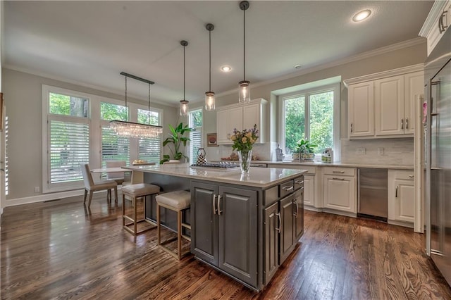 14814 Sherwood St, Leawood, KS 66224 - kitchen with white cabinetry, light countertops, dark wood-style flooring, a kitchen island, and crown molding