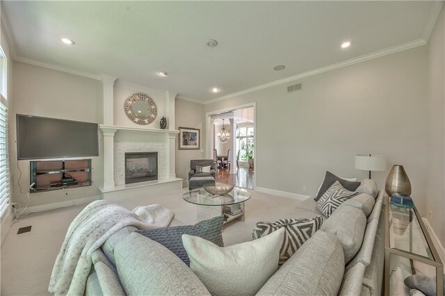 14814 Sherwood St, Leawood, KS 66224 - carpeted living area with baseboards, a glass covered fireplace, a chandelier, crown molding, and recessed lighting