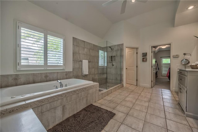 14814 Sherwood St, Leawood, KS 66224 - full bathroom featuring healthy amount of natural light, a bath, a stall shower, a ceiling fan, and lofted ceiling