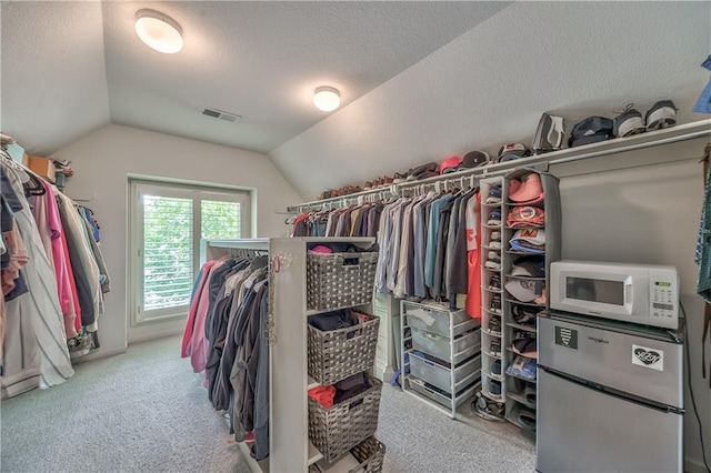 14814 Sherwood St, Leawood, KS 66224 - spacious closet featuring carpet flooring and lofted ceiling