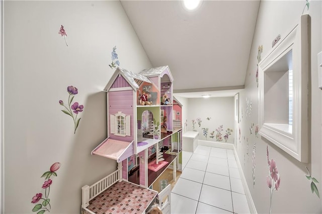 14814 Sherwood St, Leawood, KS 66224 - rec room featuring tile patterned floors, baseboards, and vaulted ceiling