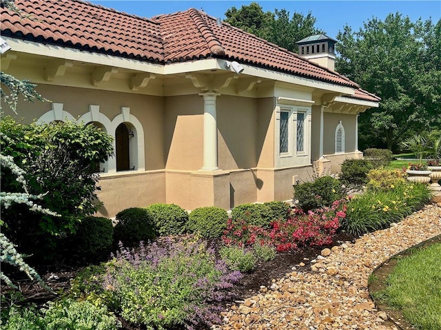 14814 Sherwood St, Leawood, KS 66224 - view of home's exterior with stucco siding and a tile roof
