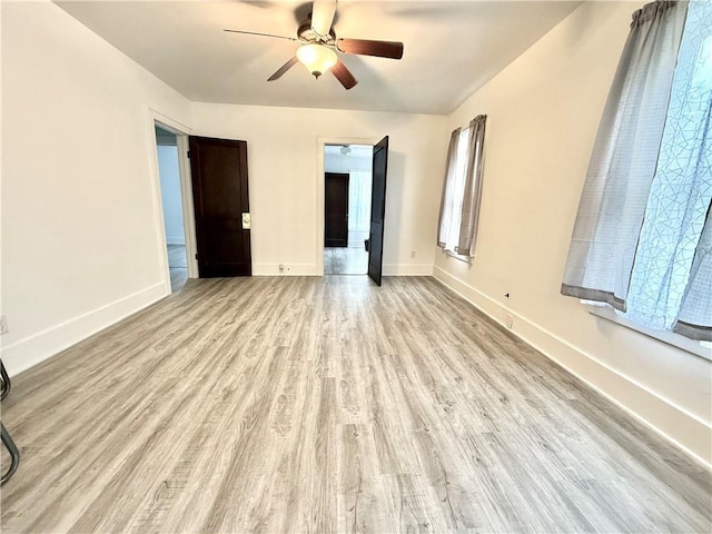 803 N Mulberry St, Maryville, MO 64468 - spare room with a ceiling fan, wood finished floors, and baseboards
