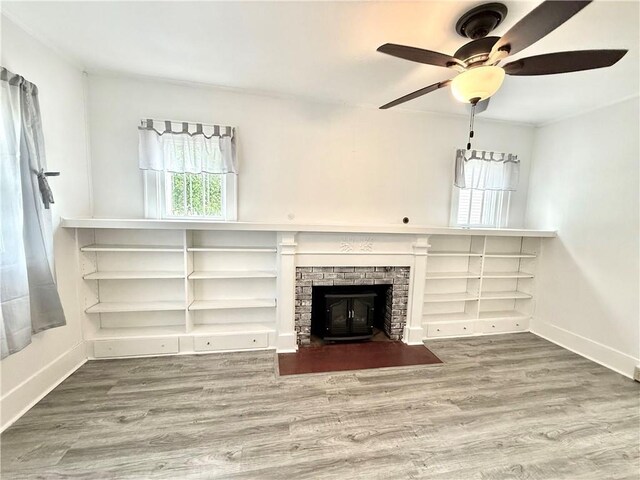 803 N Mulberry St, Maryville, MO 64468 - unfurnished living room with a ceiling fan, baseboards, and wood finished floors