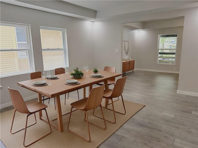 5715 Forest Ave, Kansas City, MO 64110 - dining area featuring baseboards and light wood-style flooring