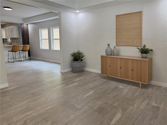 5715 Forest Ave, Kansas City, MO 64110 - living area with light wood-style flooring and baseboards