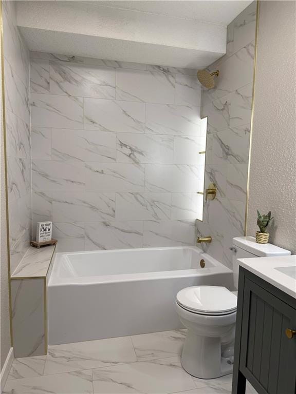 5715 Forest Ave, Kansas City, MO 64110 - bathroom featuring vanity, bathing tub / shower combination, marble finish floors, and a textured wall