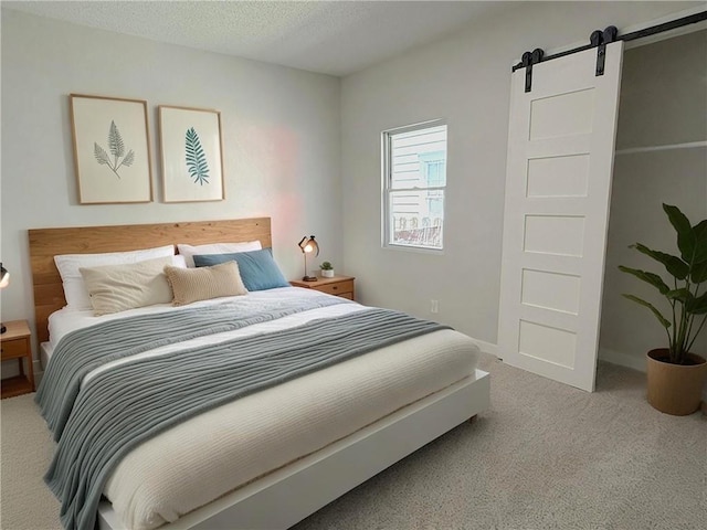 5715 Forest Ave, Kansas City, MO 64110 - bedroom with a barn door and carpet